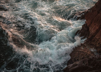 High angle view of rock formation in sea