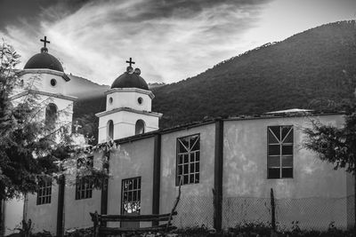 Exterior of church with mountain against sky