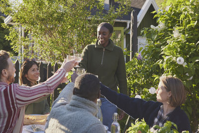 Friends having meal in garden