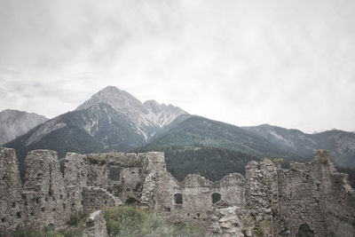 Scenic view of mountains against cloudy sky