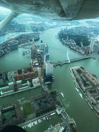 High angle view of modern buildings by sea