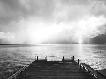 Pier over sea against sky