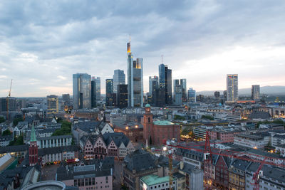 Aerial view of buildings in city frankfurt/m against cloudy sky