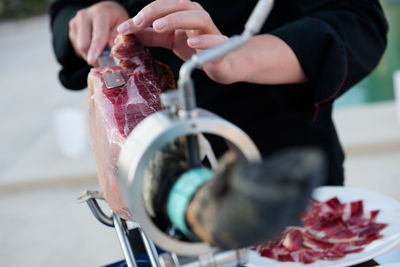 Close-up of man preparing food