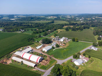 An aerial view of farm and fields on a summer day.