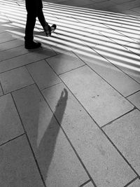 Low section of person walking on footpath