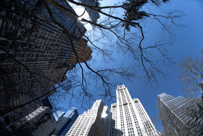 Low angle view of buildings against blue sky