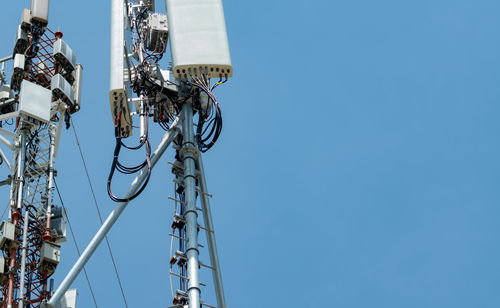 Telecommunication tower with clear blue sky background. the antenna against the blue sky. radio pole