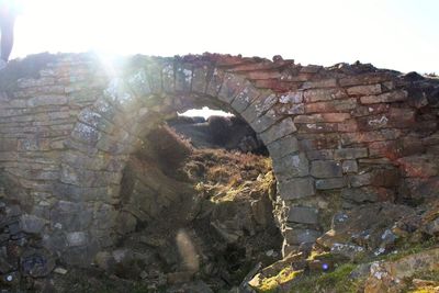 Close-up of old ruin against clear sky