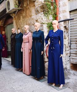 Group of display dummies standing against the wall