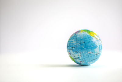 Close-up of globe against white background