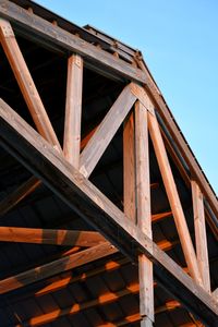 Low angle view of metallic structure against clear sky