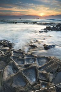 Scenic view of sea against dramatic sky