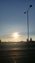 Street against sky during sunset