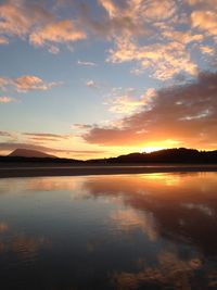 Scenic view of lake against sky during sunset