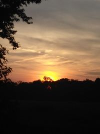 Scenic view of silhouette landscape against sky at sunset