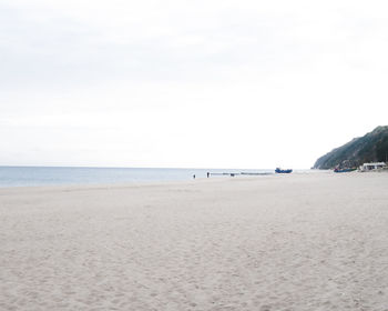 Scenic view of beach against clear sky