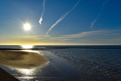 Scenic view of sea against sky at sunset