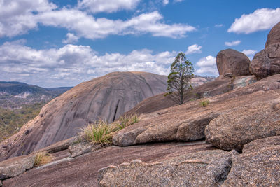 Scenic view of mountains against cloudy sky