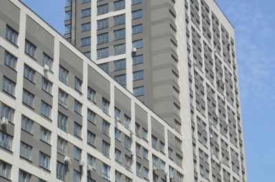 Low angle view of apartment building against sky