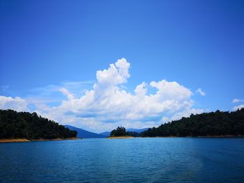 Scenic view of lake against blue sky