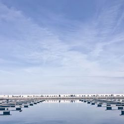 Empty harbor against sky