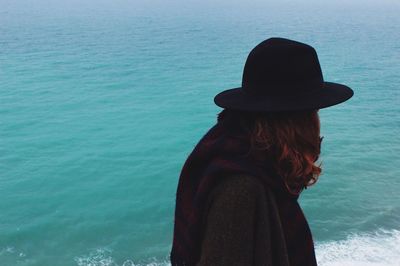 Woman standing by sea