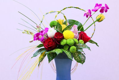 Close-up of flower vase against white background