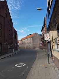 Street in city against sky