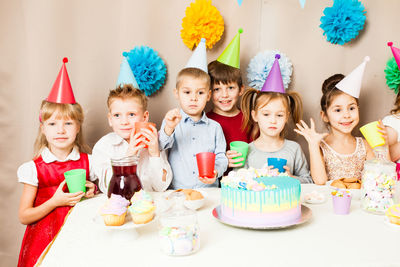 High angle view of friends on table