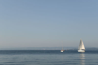 Boats sailing in sea