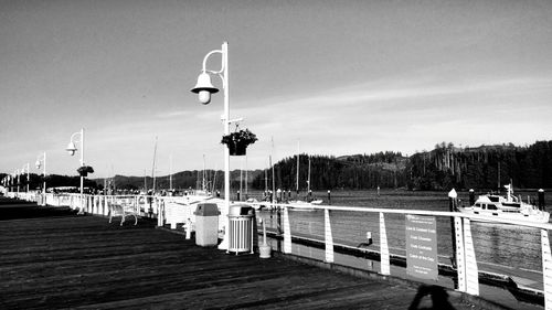 Pier over lake against sky