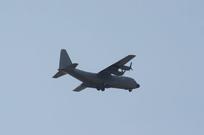 Low angle view of airplane against clear sky