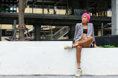 Portrait of woman sitting outdoors