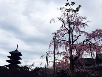 Low angle view of building against cloudy sky