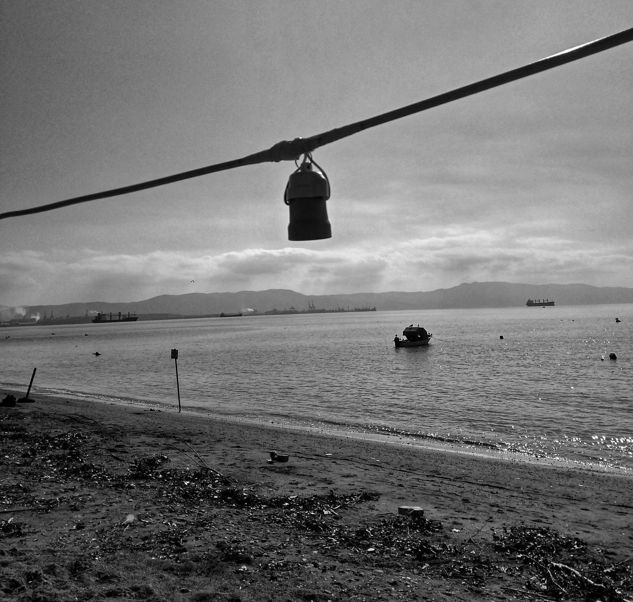 VIEW OF HANGING FROM SEA AGAINST SKY