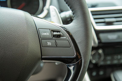 Close-up of steering wheel in car