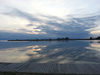 Scenic view of sea against cloudy sky