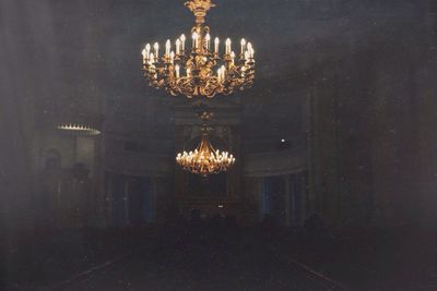 Illuminated lamp post at night