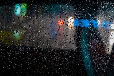 Full frame shot of wet glass window in rainy season