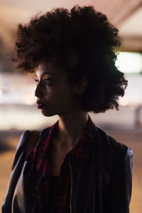 Silhouette woman with afro hairstyle during sunset