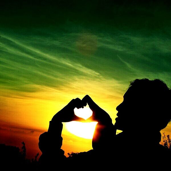 silhouette, sunset, sun, scenics, nature, outdoors, sky, beauty in nature, human hand, adult, day, people, adults only