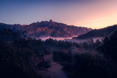 Scenic view of mountains against sky during sunset