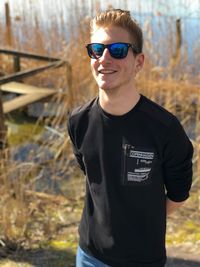 Smiling young man wearing sunglasses