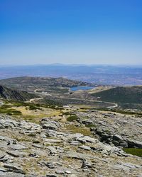 Scenic view of landscape against blue sky