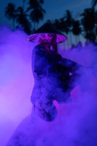 Woman standing on purple flower