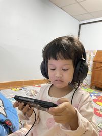 Portrait of girl looking away at home