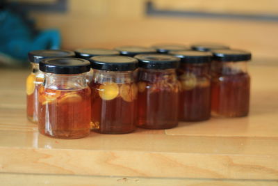 Close-up of drink in glass jar on table