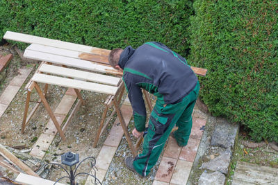 High angle view of worker working by plants