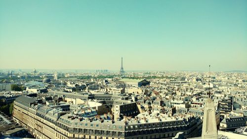 Aerial view of cityscape against clear sky